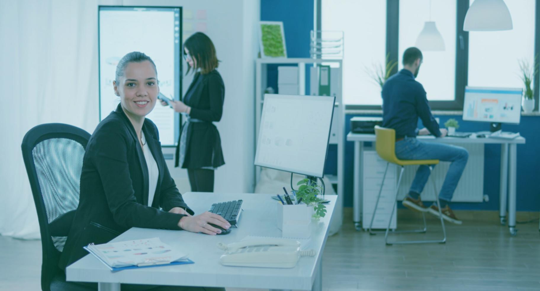 Founder reviewing financial model on a laptop at a standing desk